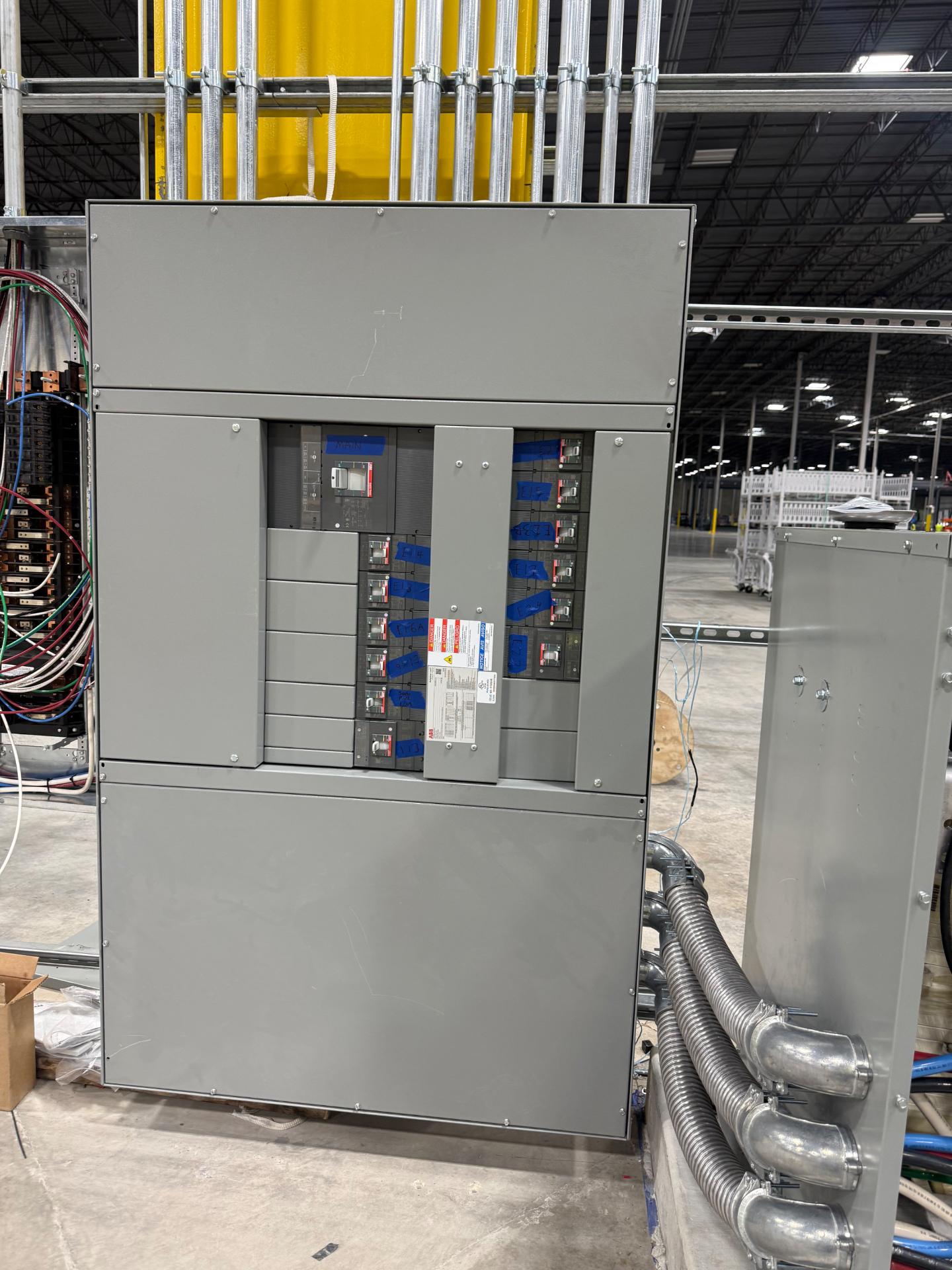 Industrial switchgear with labeled breakers installed by SolidLine TX